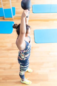 Young woman getting into shape with one more training session