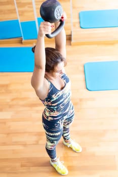 Young woman getting into shape with one more training session