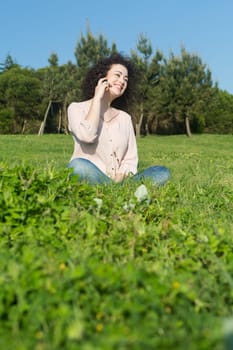 A beautiful young woman relaxing at the city park