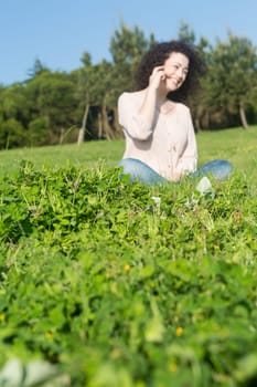 A beautiful young woman relaxing at the city park