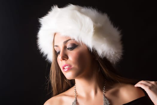 A beautiful young woman dressed with winter clothes