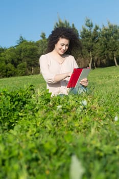 A beautiful young woman relaxing at the city park