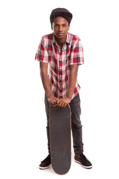 A young black skater posing in studio