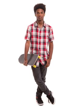 A young black skater posing in studio