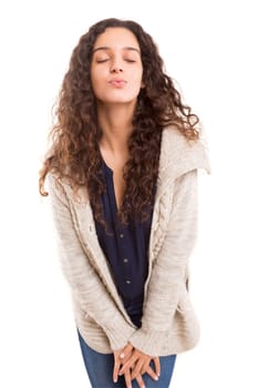 Beautiful young woman blowing you a kiss, isolated over white