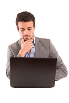 Young handsome man working with laptop computer