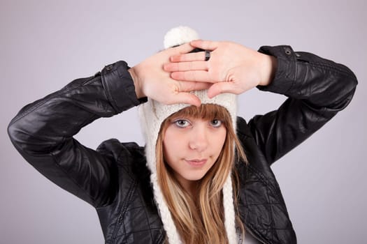 Beautiful woman posing, isolated over grey background