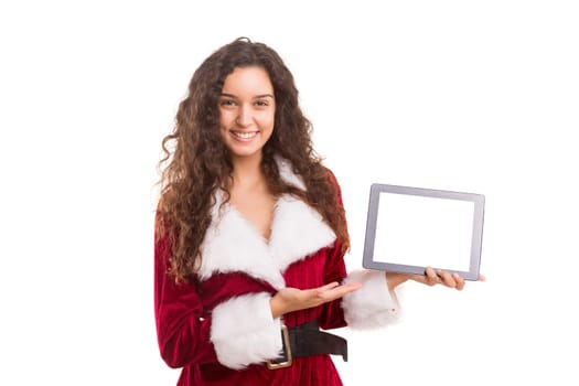Young woman dress in Christmas costume, presenting your product on a tablet computer