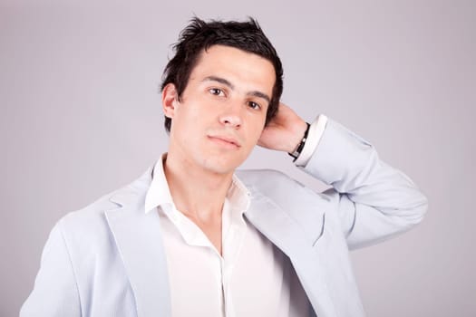 Young casual boy posing isolated