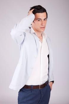 Young casual boy posing isolated