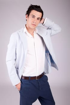 Young casual boy posing isolated