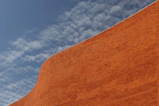 Detail of a Bricked Wall in a beautiful background blue sky