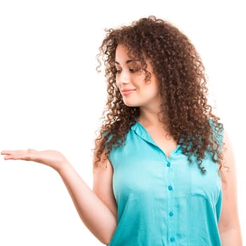 Young beautiful woman presenting your product, isolated over white background