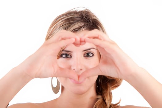form of heart shaped by the hands of a young woman