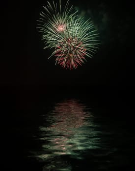 Fireworks with reflexes on water