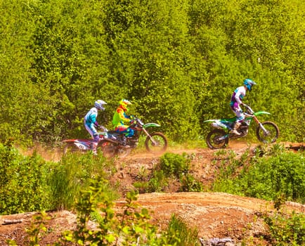 Kamchatka, Russia- 29 June 2019: Motocross riders practice tricks on their dirt bikes on a sunny day in Kamchatka