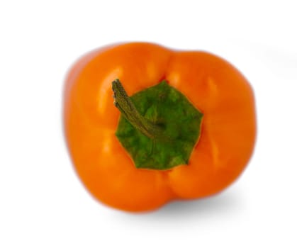 Blurred and Select focus image. Orange pepper isolated on white background