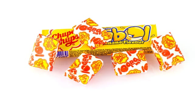 Kamchatka, Russia - 26 May 2018: Yellow chupa chups candy on white background
