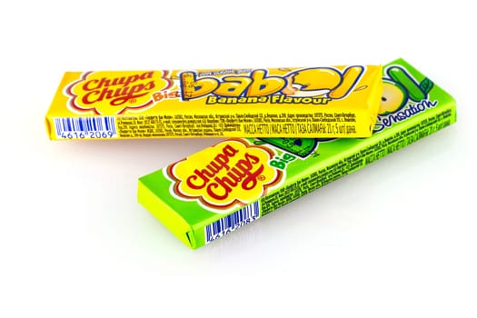 Kamchatka, Russia - 26 May 2018: Yellow and green chupa chups candy on white background