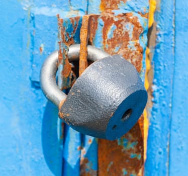Padlock on the door. Rusty gate Close up