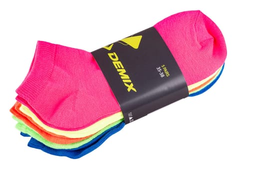 Kamchatka, Russia - 10 Jule 2019: Brand Demix colorful socks isolated on white background.