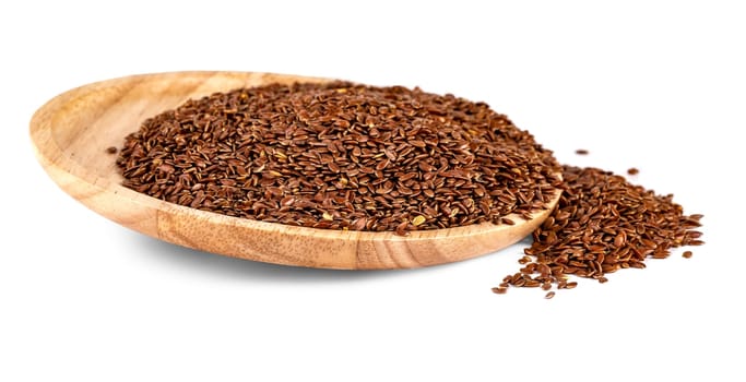 Flax seeds in a wooden plate isolated on a white background
