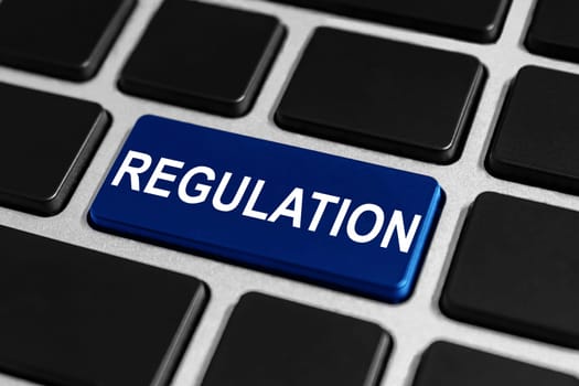 regulation blue button on keyboard, business concept