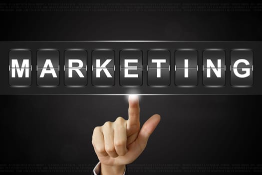 business hand pushing marketing on Flipboard Display