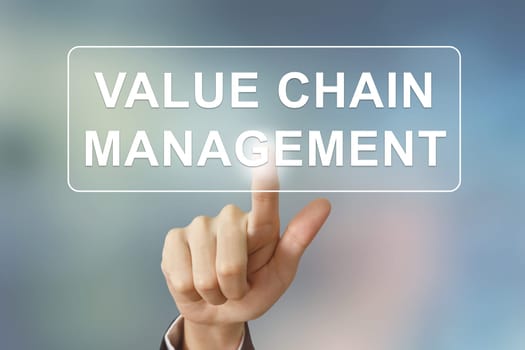business hand pushing value chain management button on blurred background