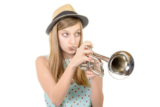 teenager with a hat plays the trumpet