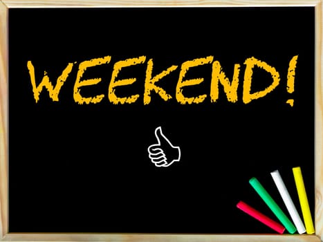Weekend  message and Like sign.Handwriting with chalk on wooden frame blackboard, colored chalk in the corner, Leisure concept image