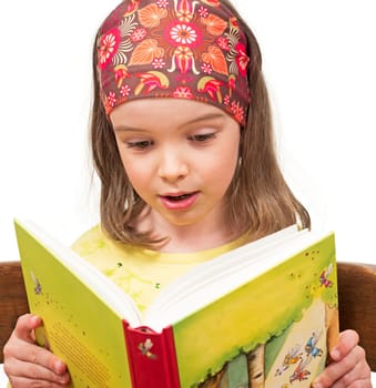 Child reads a book