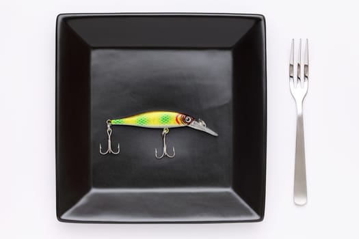 plastic fishing lure on plate