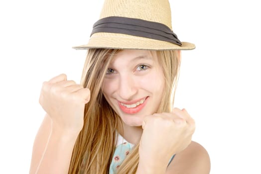 smiling teenager showing fists on white background