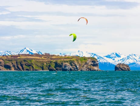 Kitesurfing, kiteboarding, kite surf. Extreme sport kitesurfing in Kamchatka Peninsula in the Pacific ocean