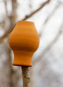 The old clay jug on a stump