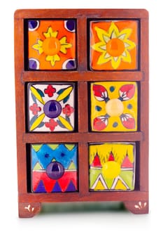 Small decorative stylish colorful printed oriental cupboard with foots with ceramic shelves on isolated background