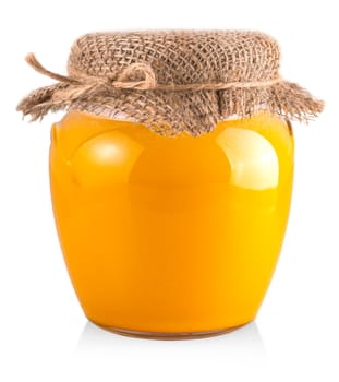 The yellow honey jar on white background