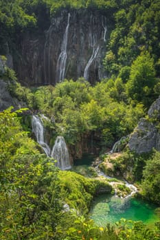 Vertical view on beautiful turquoise coloured lakes and Veliki Slap, tallest waterfall in Plitvice Lakes, National Park UNESCO World Heritage, Croatia