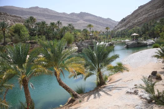 The famous Wadi Bani Khalid is located in the Shamal asch Sharqiyya district in the Hajar Mountains and near the Muqal Cave. The oasis is located in the Sultanate of Oman.