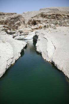 The famous Wadi Bani Khalid is located in the Shamal asch Sharqiyya district in the Hajar Mountains and near the Muqal Cave. The oasis is located in the Sultanate of Oman.