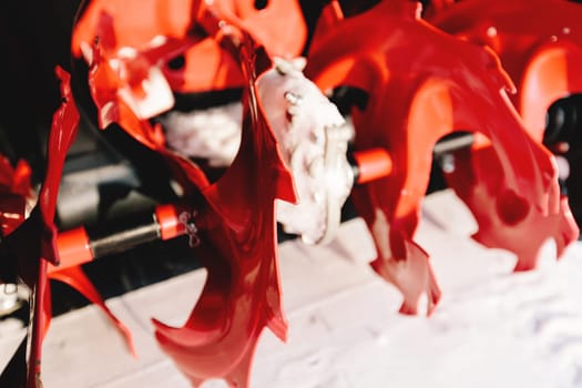Red-black snowblower machine in the process of work. High quality photo