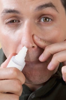 Man using nasal spray
