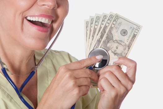 Doctor checking currency notes with a stethoscope