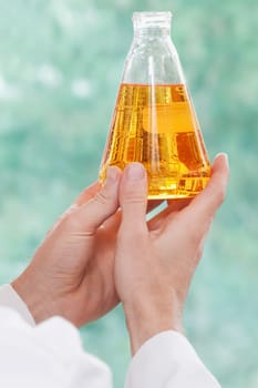 Doctor holding a conical flask in a laboratory