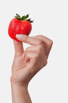 WomanŽs hand holding a strawberry