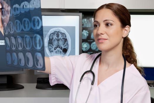 Female doctor examining an x_ray report