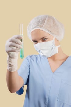 Female lab technician analyzing a test tube
