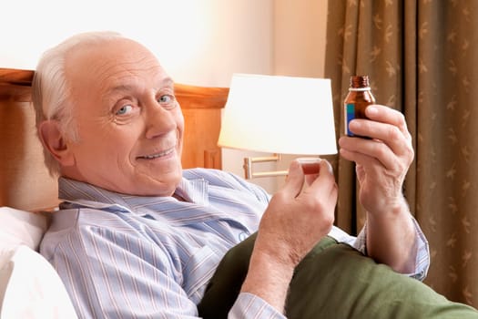 Portrait of a man taking medicine