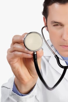 Close_up of a doctor holding a stethoscope